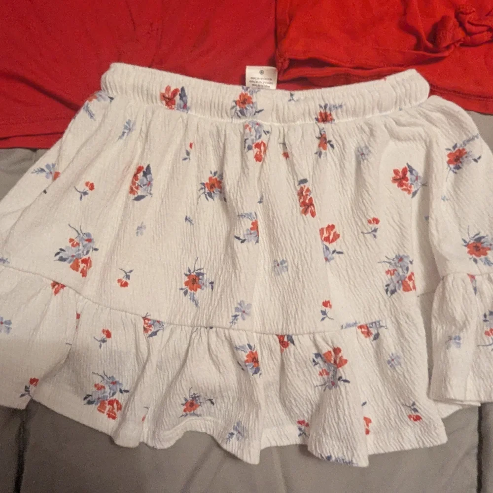 2 Red Tops and Floral White Skort